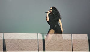 Charli XCX gives a free pop-up concert in collaboration with H&M, performing a "Brat" setlist in Times Square on Monday, Nov. 18, 2024. | Photo by Setoxxx via Wikimedia Commons, licensed under CC BY-SA 4.0. Charli XCX gives a free pop-up concert in collaboration with H&M, performing a "Brat" setlist in Times Square on Monday, Nov. 18, 2024. | Photo by Setoxxx via Wikimedia Commons, licensed under CC BY-SA 4.0.