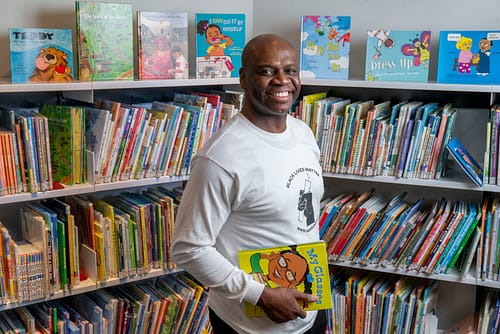 Floyd Stokes is the founder and executive director of the American Literacy Corporation (ALC) established in August of 2000, and wrote all the books on the top shelf at the East Shore Library in Lower Paxton Township, Pa., Feb. 16, 2021. Mark Pynes | mpynes@pennlive.com