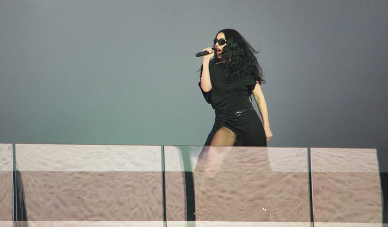 Charli XCX gives a free pop-up concert in collaboration with H&M, performing a "Brat" setlist in Times Square on Monday, Nov. 18, 2024. | Photo by Setoxxx via Wikimedia Commons, licensed under CC BY-SA 4.0. Charli XCX gives a free pop-up concert in collaboration with H&M, performing a "Brat" setlist in Times Square on Monday, Nov. 18, 2024. | Photo by Setoxxx via Wikimedia Commons, licensed under CC BY-SA 4.0.