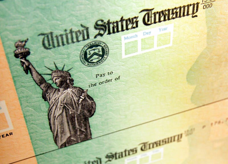 FILE - This May 8, 2008, file photo shows blank checks on an idle press at the Philadelphia Regional Financial Center, which disburses payments on behalf of federal agencies in Philadelphia. (AP Photo/Matt Rourke, File)AP | PennLive.